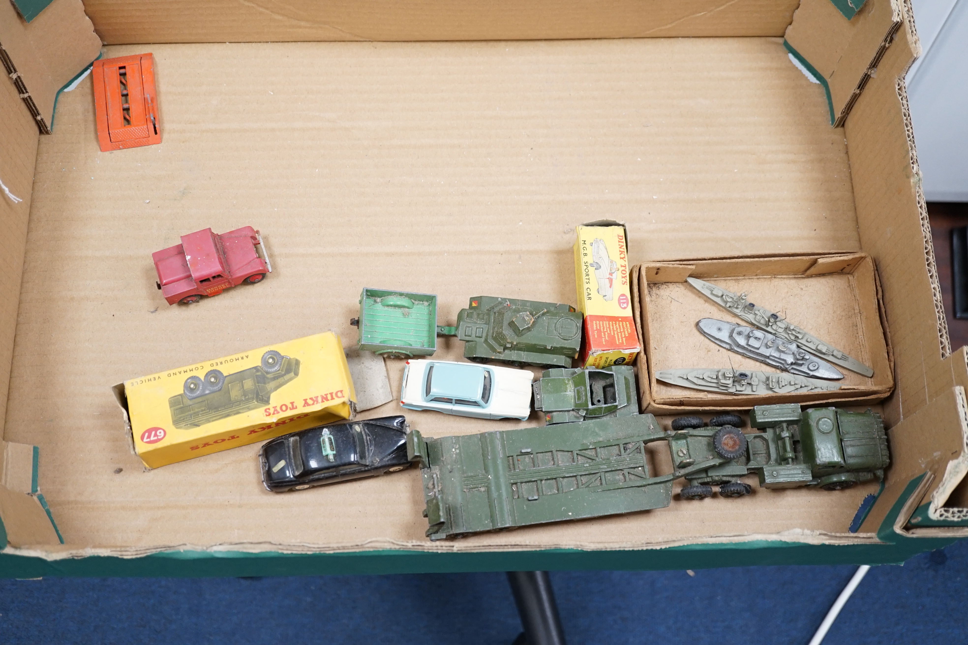Thirteen Dinky Toys and Supertoys, etc. including; an MGB (113), a Riley Pathfinder, a Triumph Herald, an Armoured Command Vehicle (677), a 20-ton Mounted Crane (972), a Recovery Tractor (661)